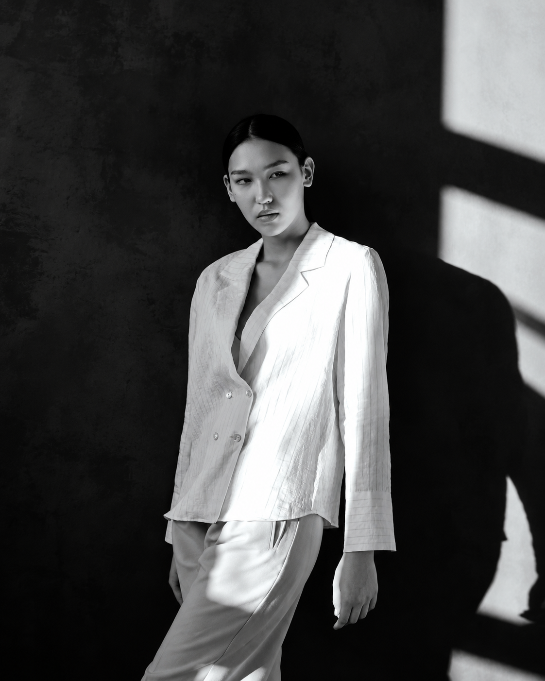 Woman in a tailored white blazer — NANATHEORY personal styling
